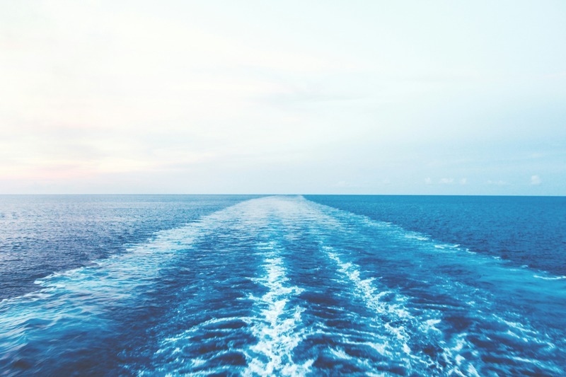 Boat wake stretching into horizon at sea. Boat wake stretching into horizon at sea.