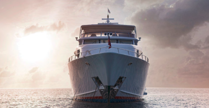 Luxury yacht seen head-on at sea. Luxury yacht seen head-on at sea.
