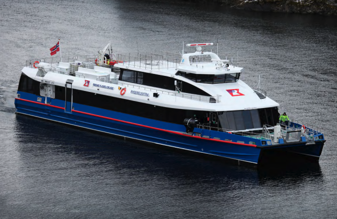 White and red fast ferry docked near quay. White and red fast ferry docked near quay.