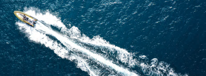 Small boat speeding on water. Small boat speeding on water.