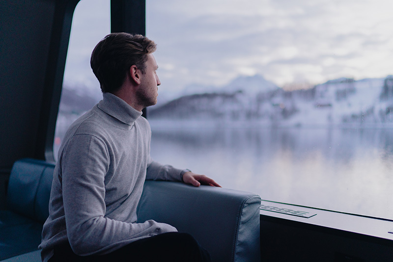 Man looking out from a boat